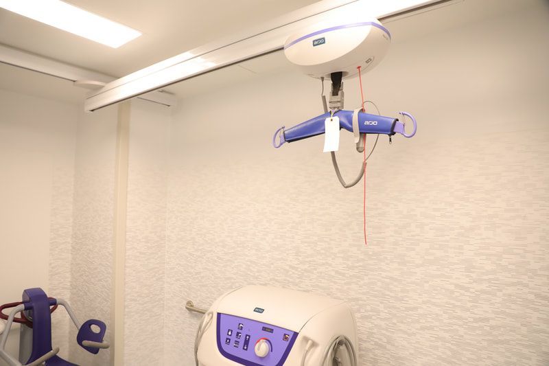 A machine is hanging from the ceiling in a room.