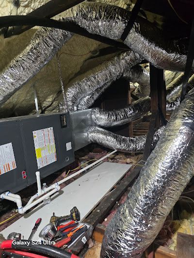 There are a lot of ducts and wires in the attic.