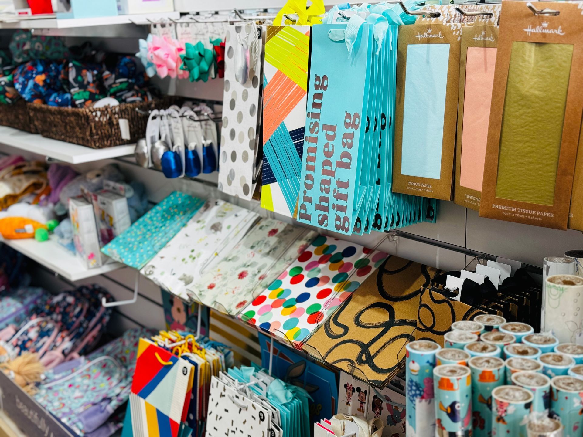 A Display Of Magazines And Balloons In A Store — Yeppoon Central Lotto & News in Yeppoon, QLD