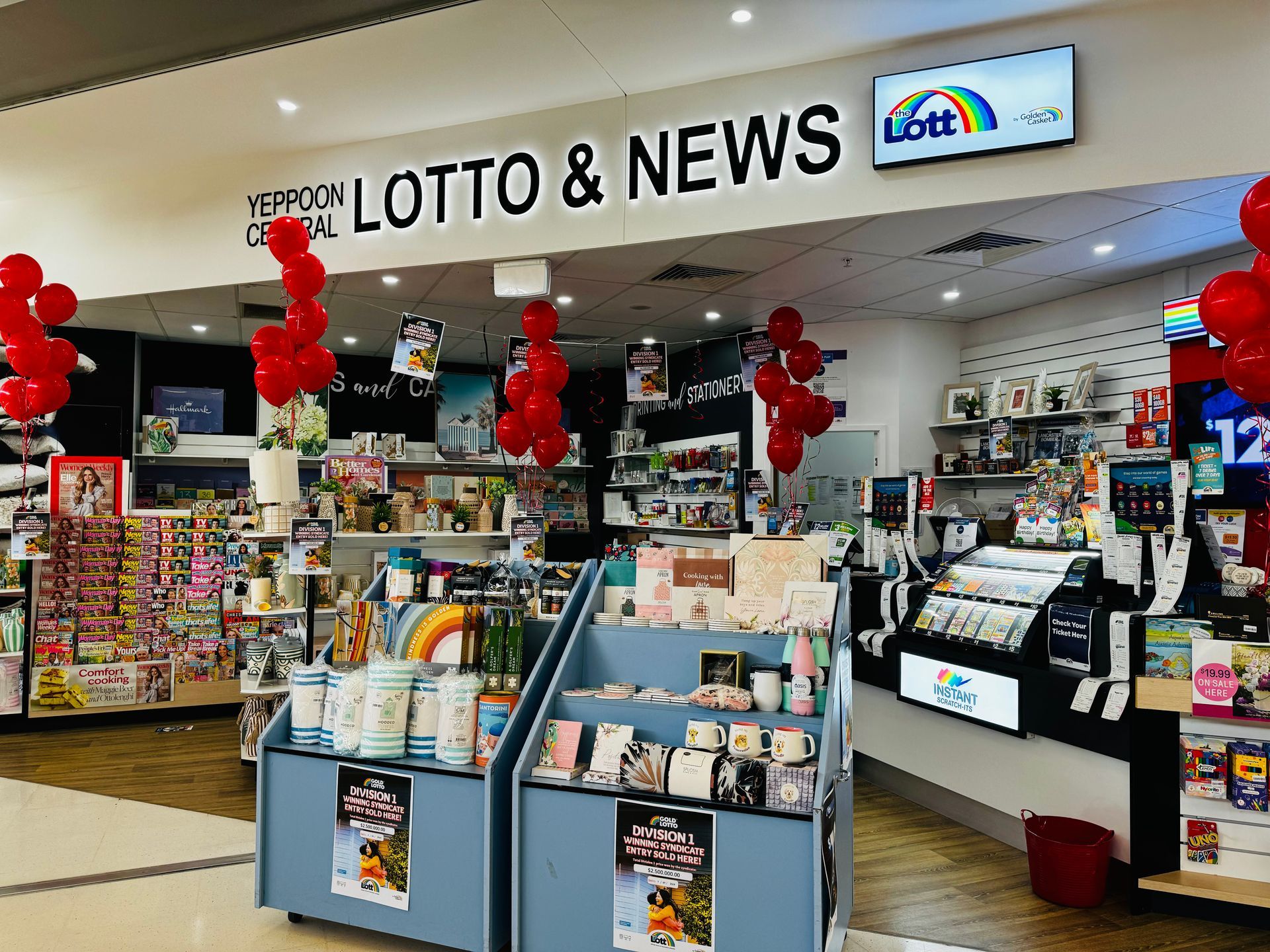 A Store Filled With Lots Of Items And Balloons — Yeppoon Central Lotto & News in Yeppoon, QLD