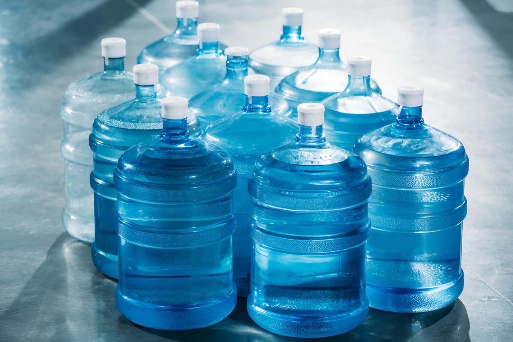 A Bunch of Water Bottles Are Stacked on Top of Each Other on a Table — Porta-Vac in Moranbah, QLD