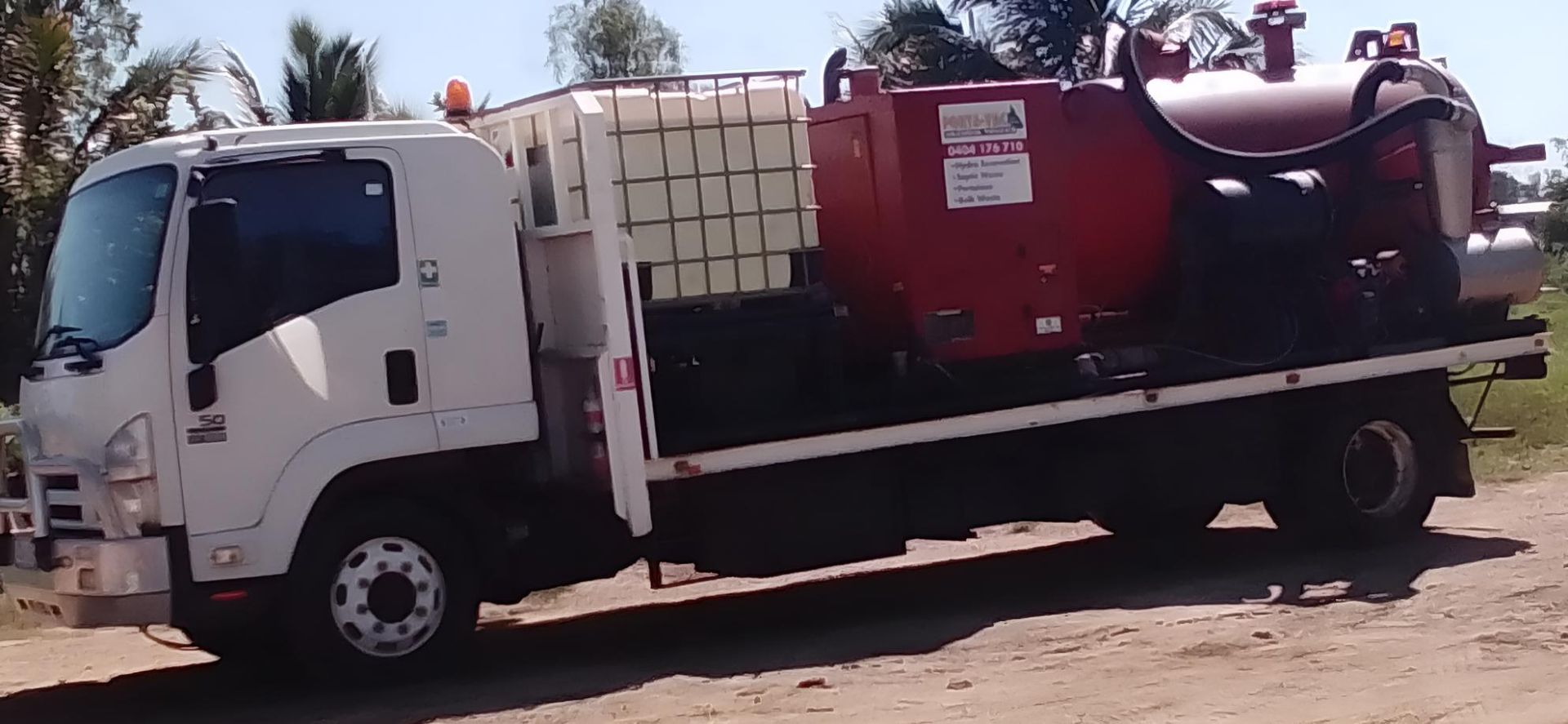 A White Truck With A Red Tank On The Back Of It — Porta-Vac in Proserpine, QLD