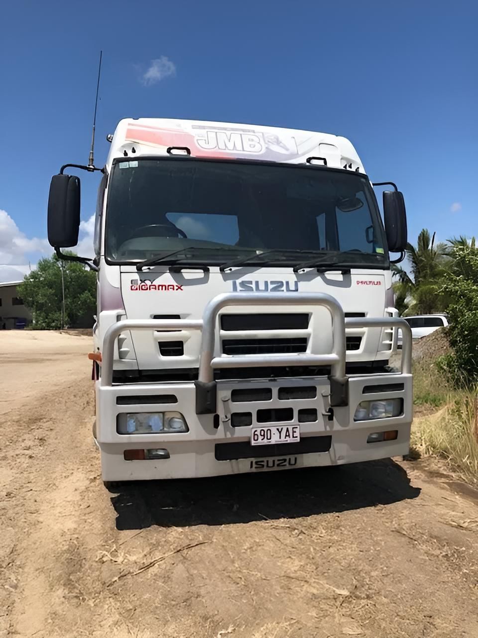 A White Truck is Parked on the Side of a Dirt Road — Porta-Vac in Bowen, QLD