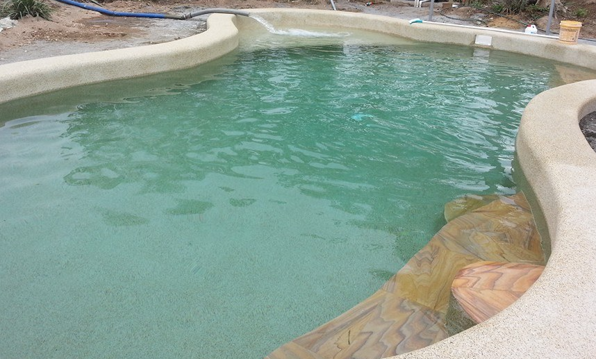 A Pool Is Being Filled With Water — Porta-Vac in Bowen, QLD