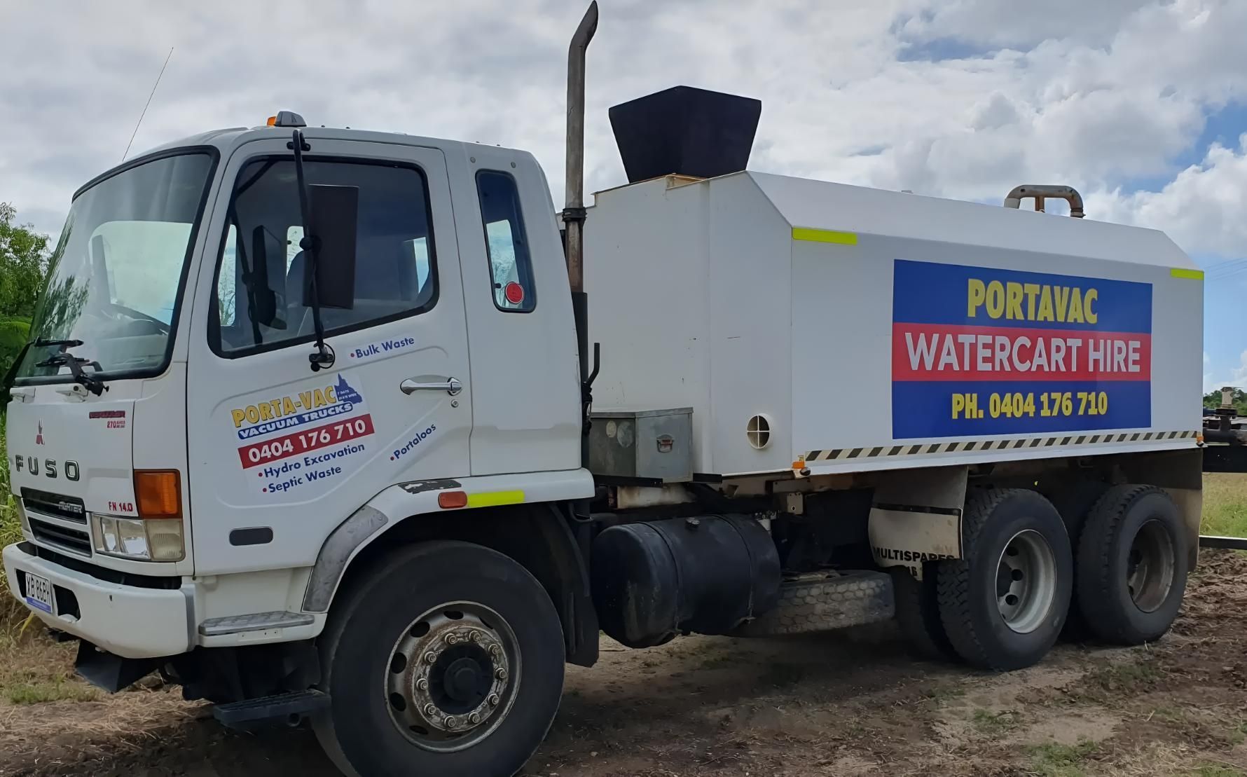 A White Truck With a Sign on the Side That Says Portal Watercart Hire — Porta-Vac in Airlie Beach, QLD