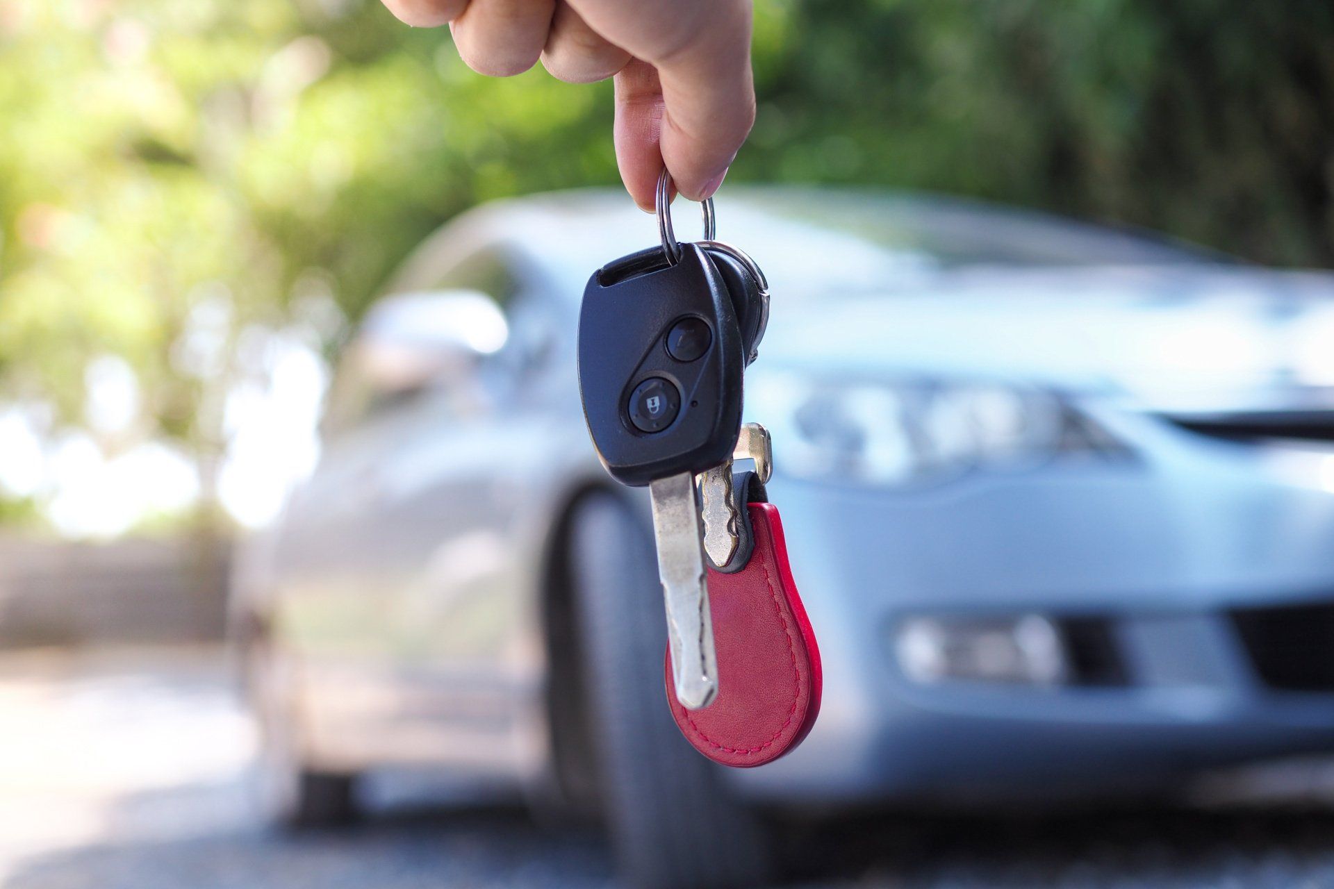 car keys being dangled in front of car