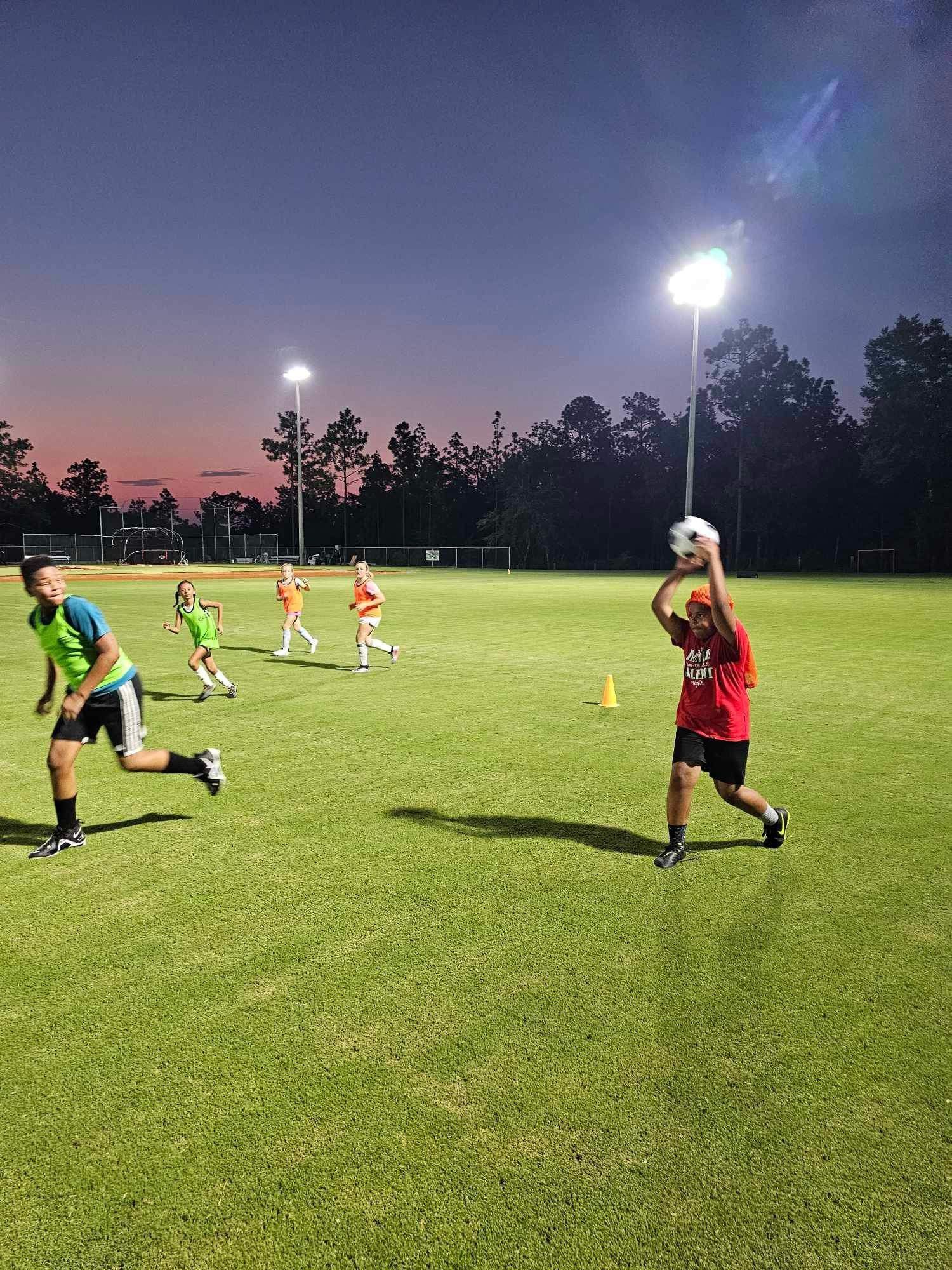 Athletes training under the lights at Foundry Athletics