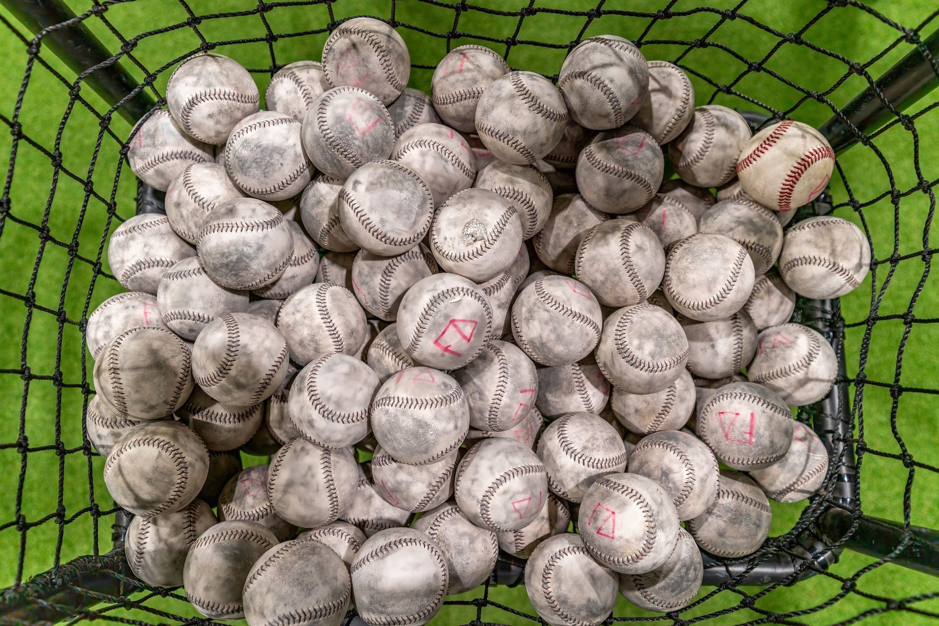 Baseballs in a training net at Foundry Athletics