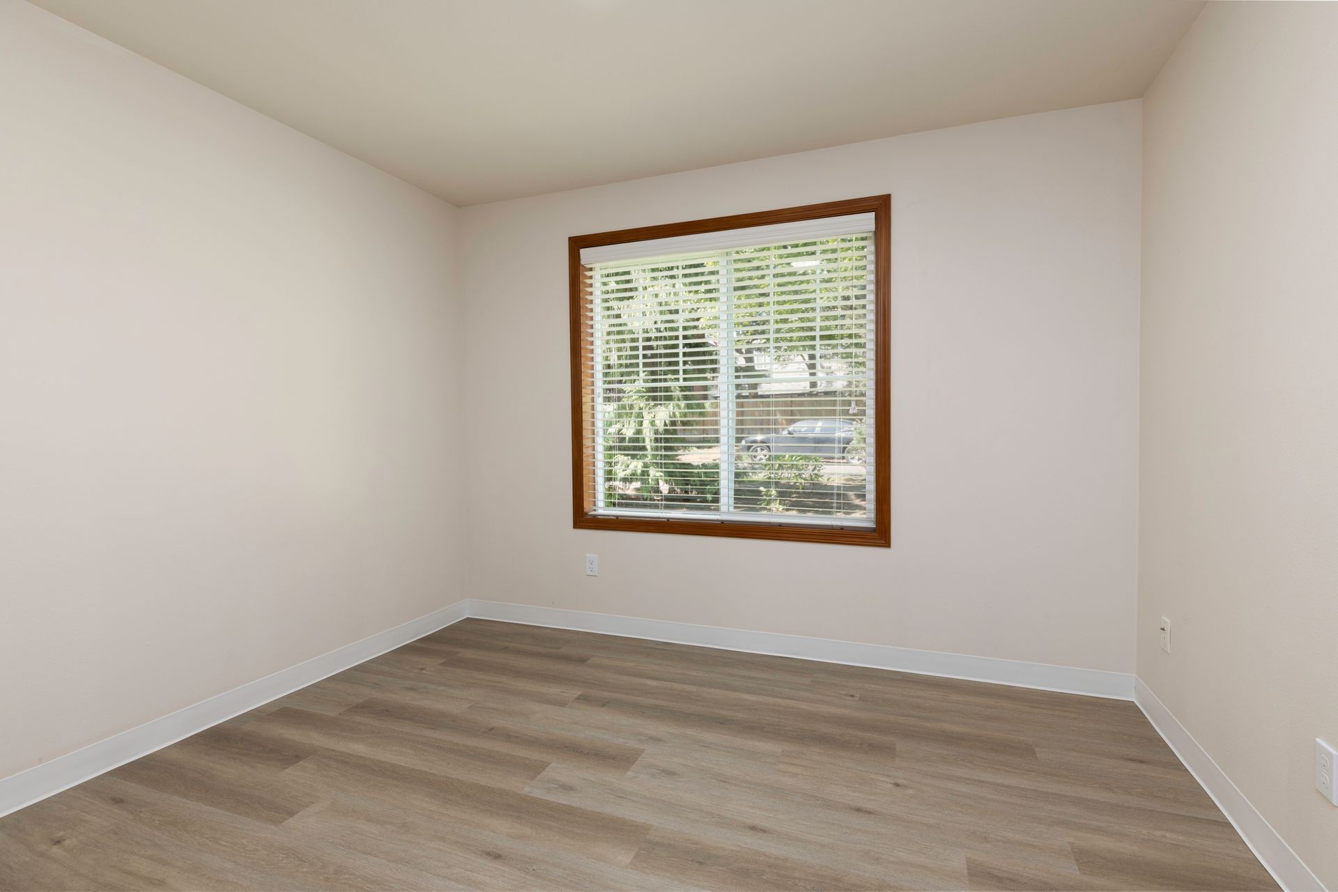 Photo of a bedroom with a wide window