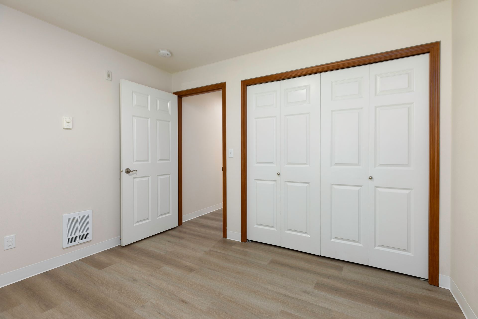 Photo of a bedroom with the door to the bedroom open