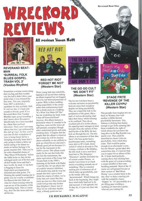 A man is holding a guitar in a magazine article about wreckord reviews