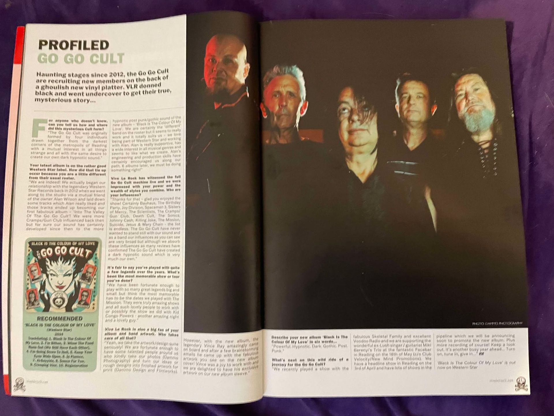 A magazine is open to a page that says profiled go go cult