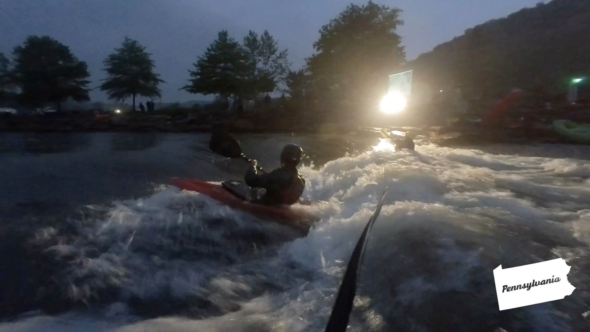kayaking on a surf wave under the lights at stonycreek rendezvous