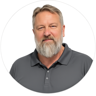 Portrait of a bearded man in a gray polo shirt on a plain white background