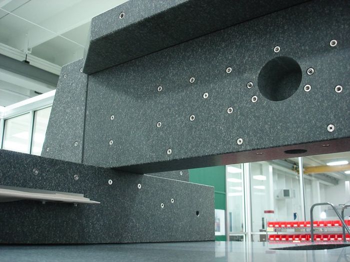 Assembly of black granite with inserts