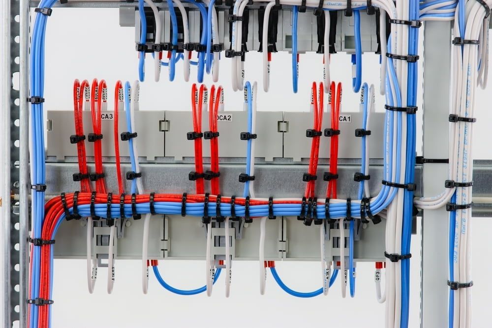 A Bunch Of Wires Are Connected To Each Other On A Wall — Homeland Electrical & Refrigeration In Braitling, NT