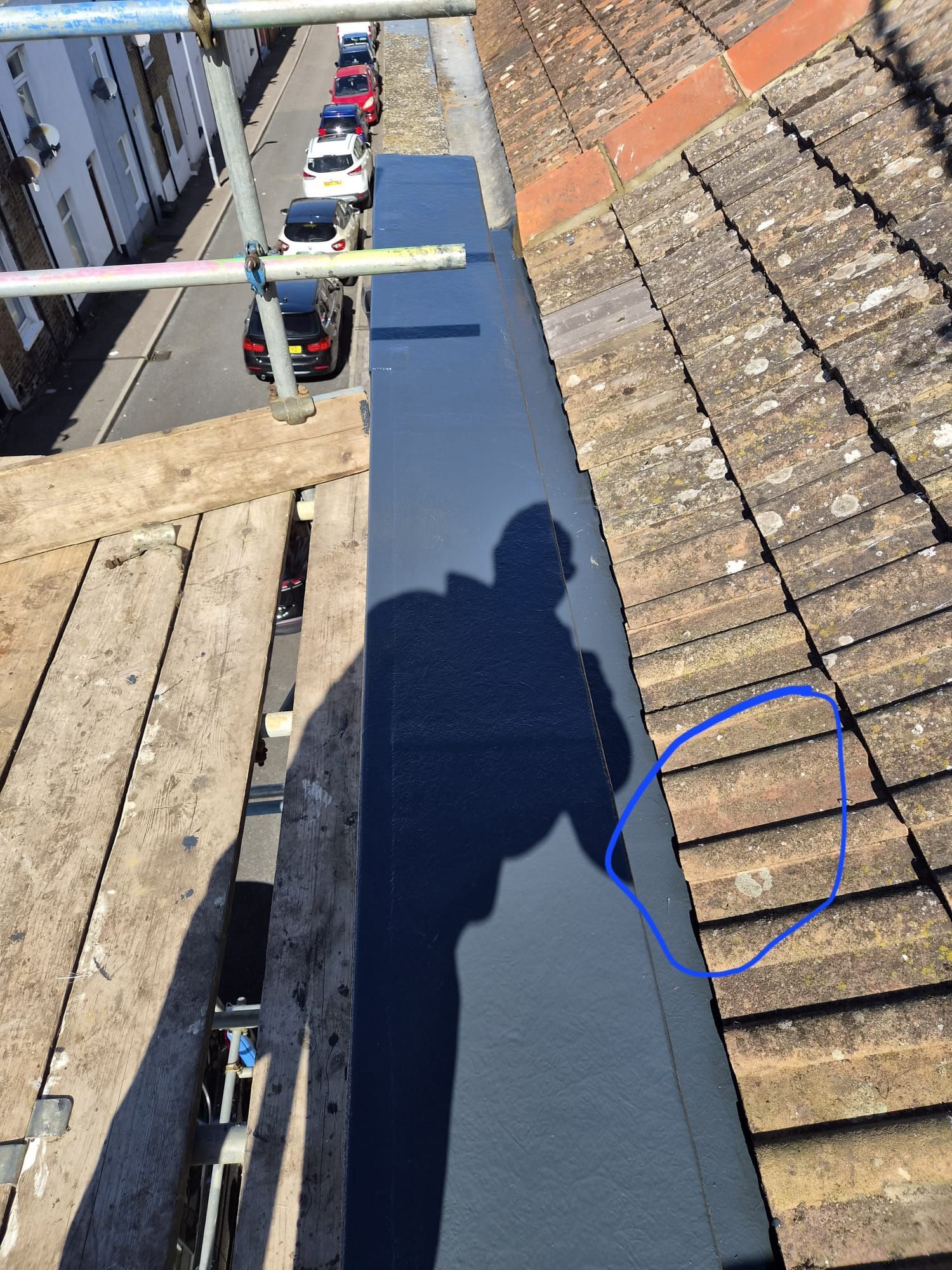 Roofing work on a tiled roof.