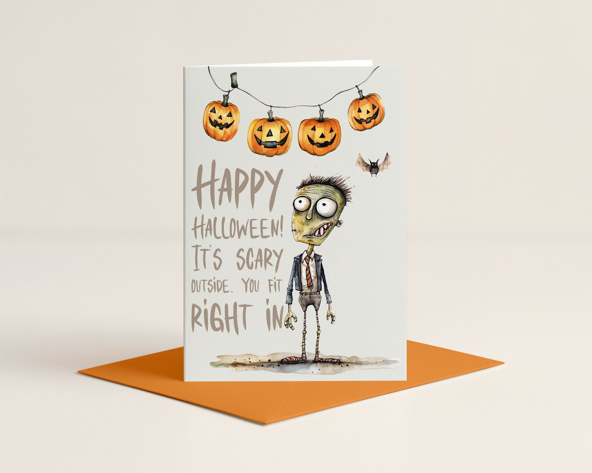 Halloween greeting card with zombie illustration, pumpkins, and lights, held in a wooden stand.