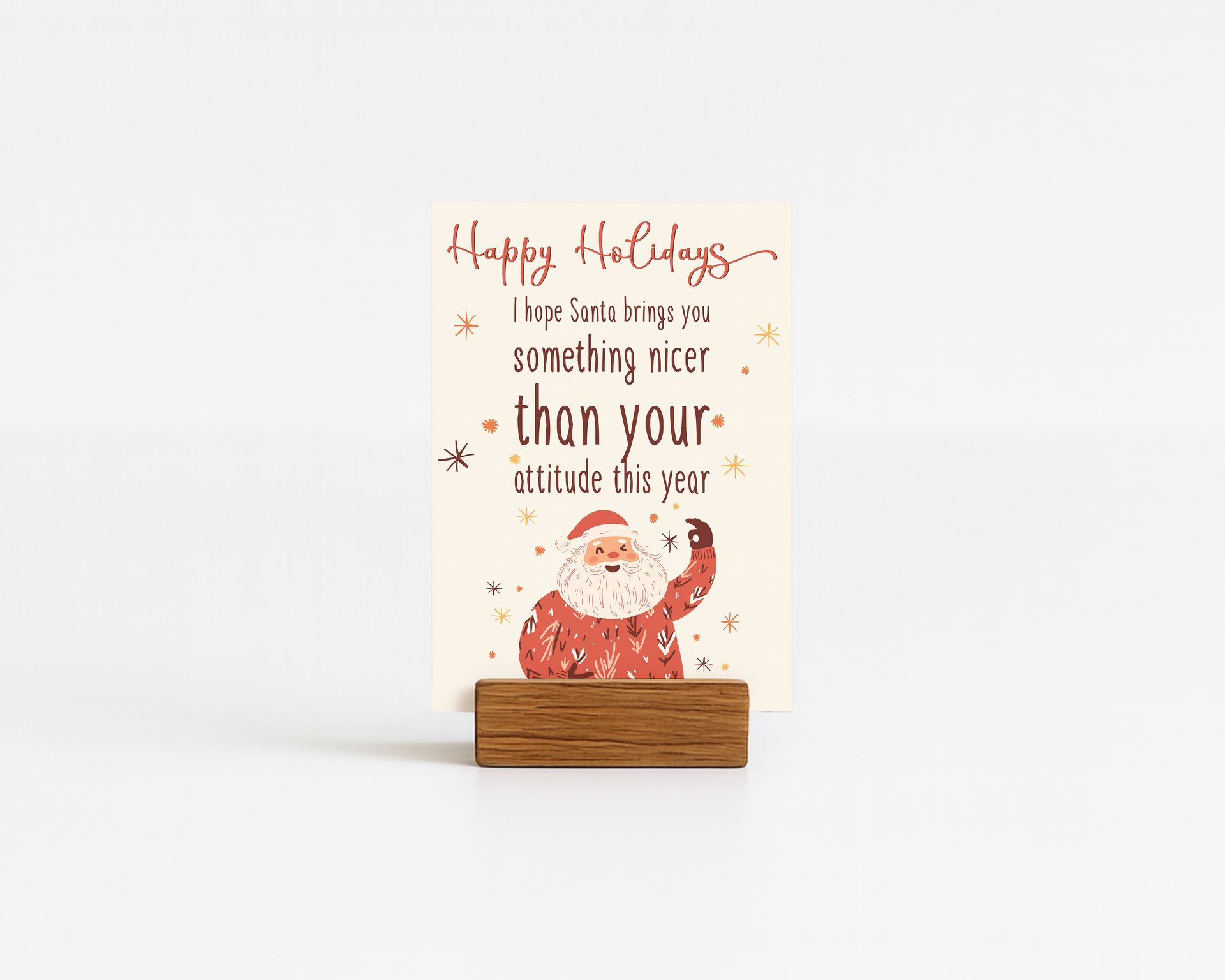 Holiday card with Santa, text "Happy Holidays". Card in wooden block holder.