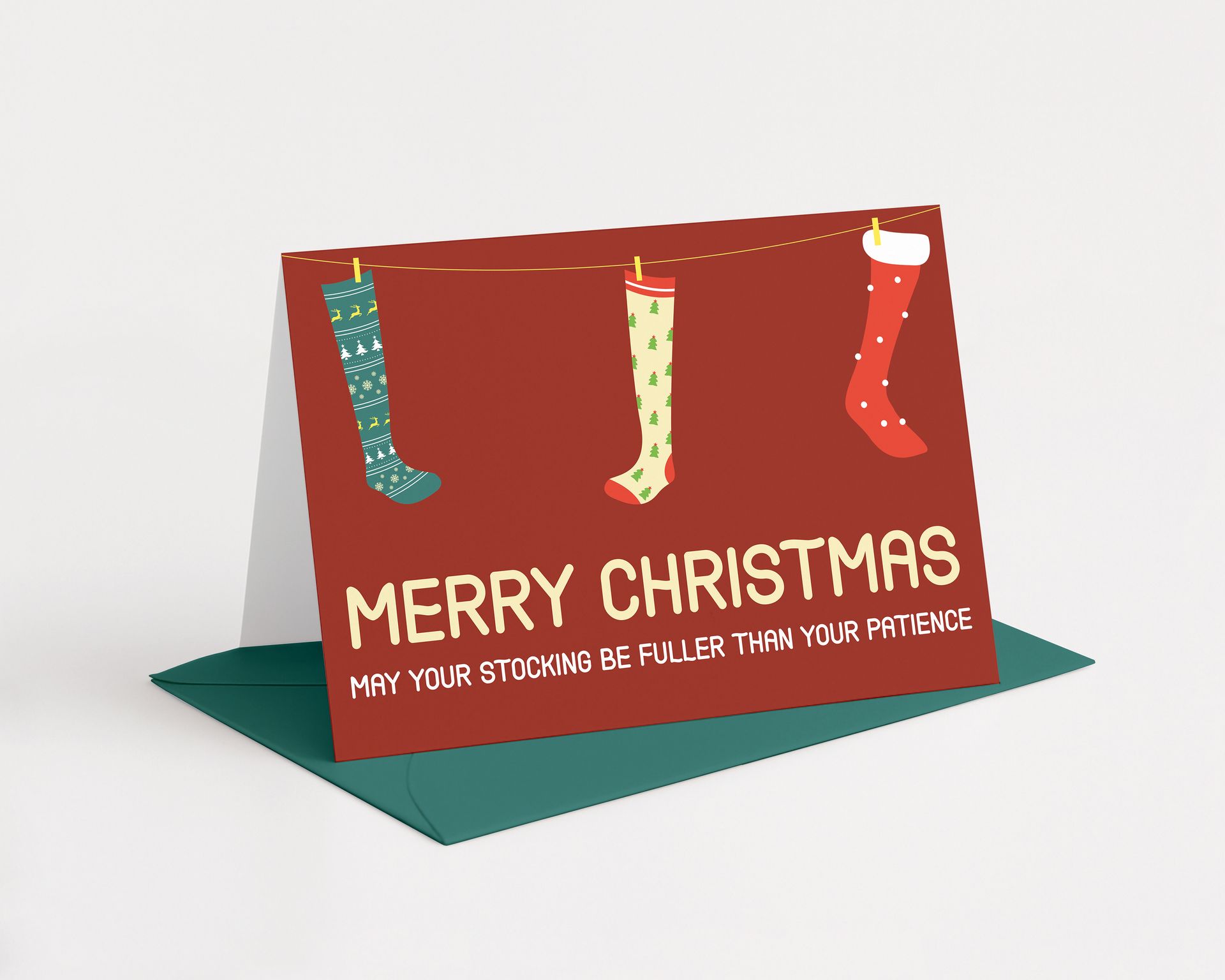 Christmas card with stockings hanging on a clothesline; red background with text