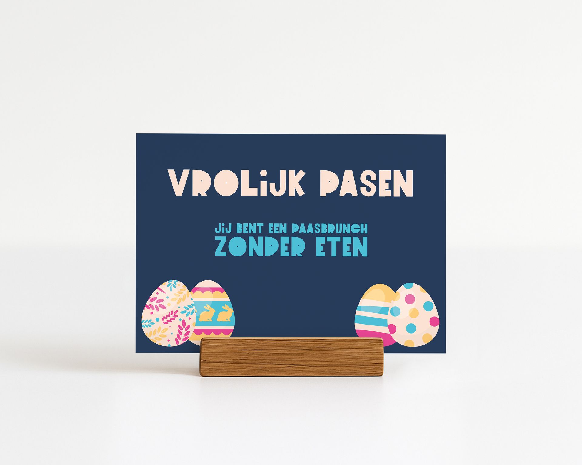 Easter card with the text "Vrolijk Pasen" and illustrated eggs on a wooden stand.