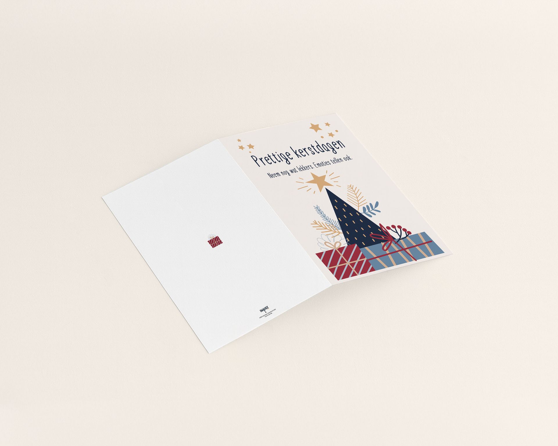 Christmas card with a tree, gifts, and text on a blue envelope.