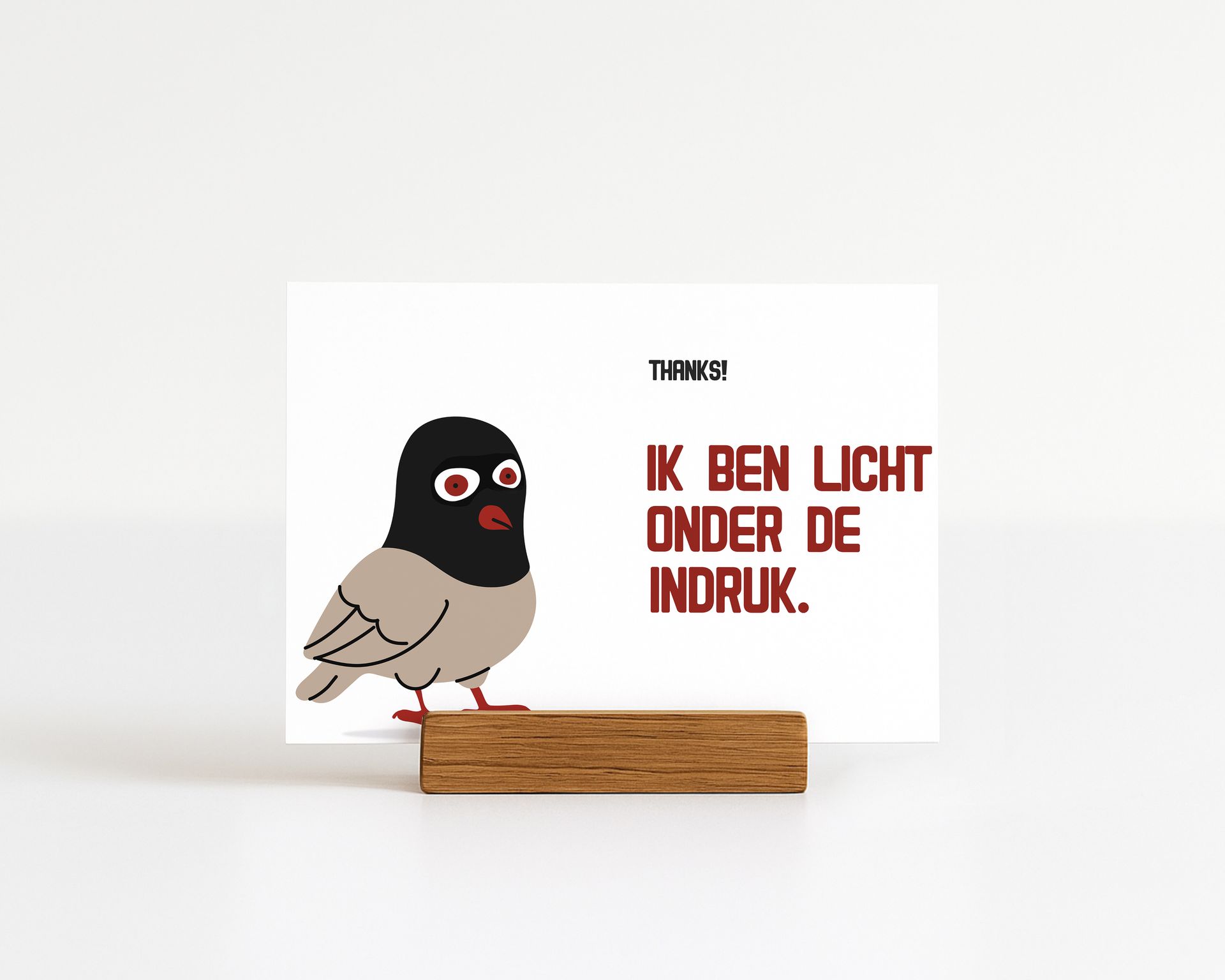 Wenskaart met een cartoonduif met een skimasker en de tekst