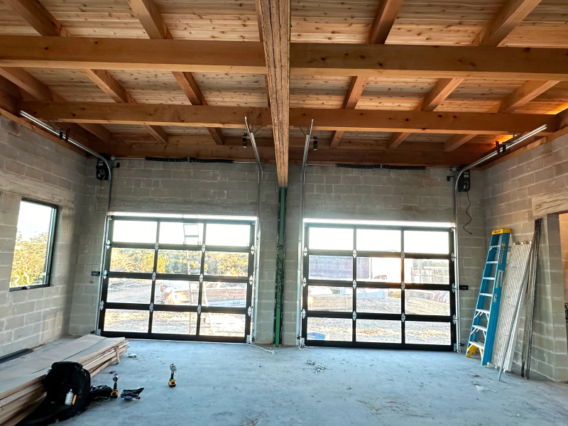 A large room with a lot of windows and a ladder in it.