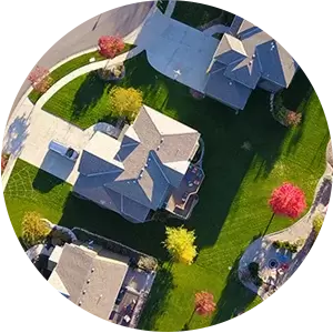 An aerial view of a residential neighborhood with houses and trees.