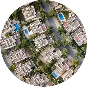 An aerial view of a residential area with lots of houses and trees.