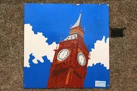 a painting of big ben clock tower on a blue and white background