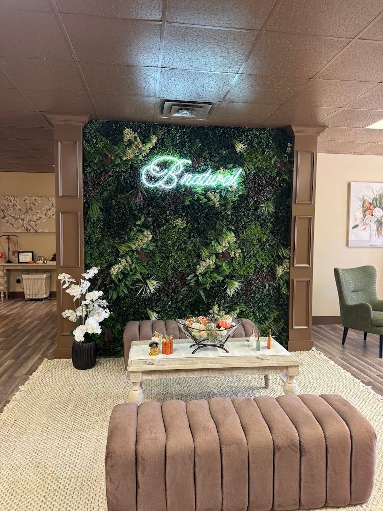 A living room with a green wall and a coffee table.