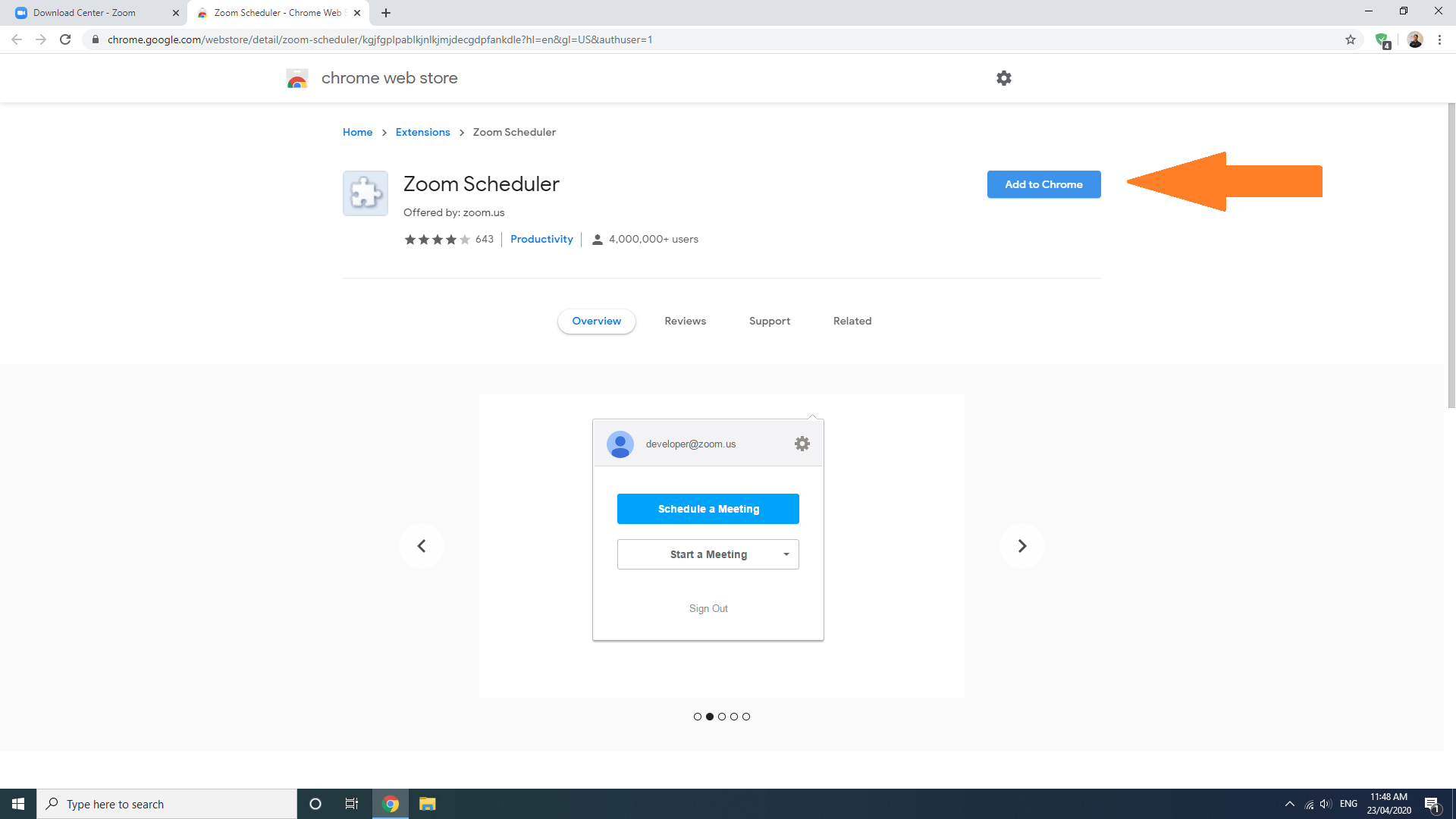 Web browser page with a large orange arrow pointing to a blue button in the top right.