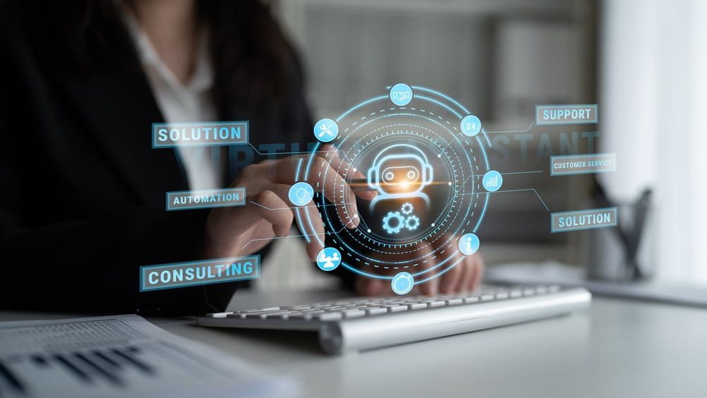 Hands typing on laptop with glowing digital customer support interface and icons hovering above keyboard