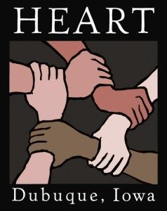 A logo for HEART in Dubuque, Iowa, featuring four hands of various skin tones interlocking in a circle.