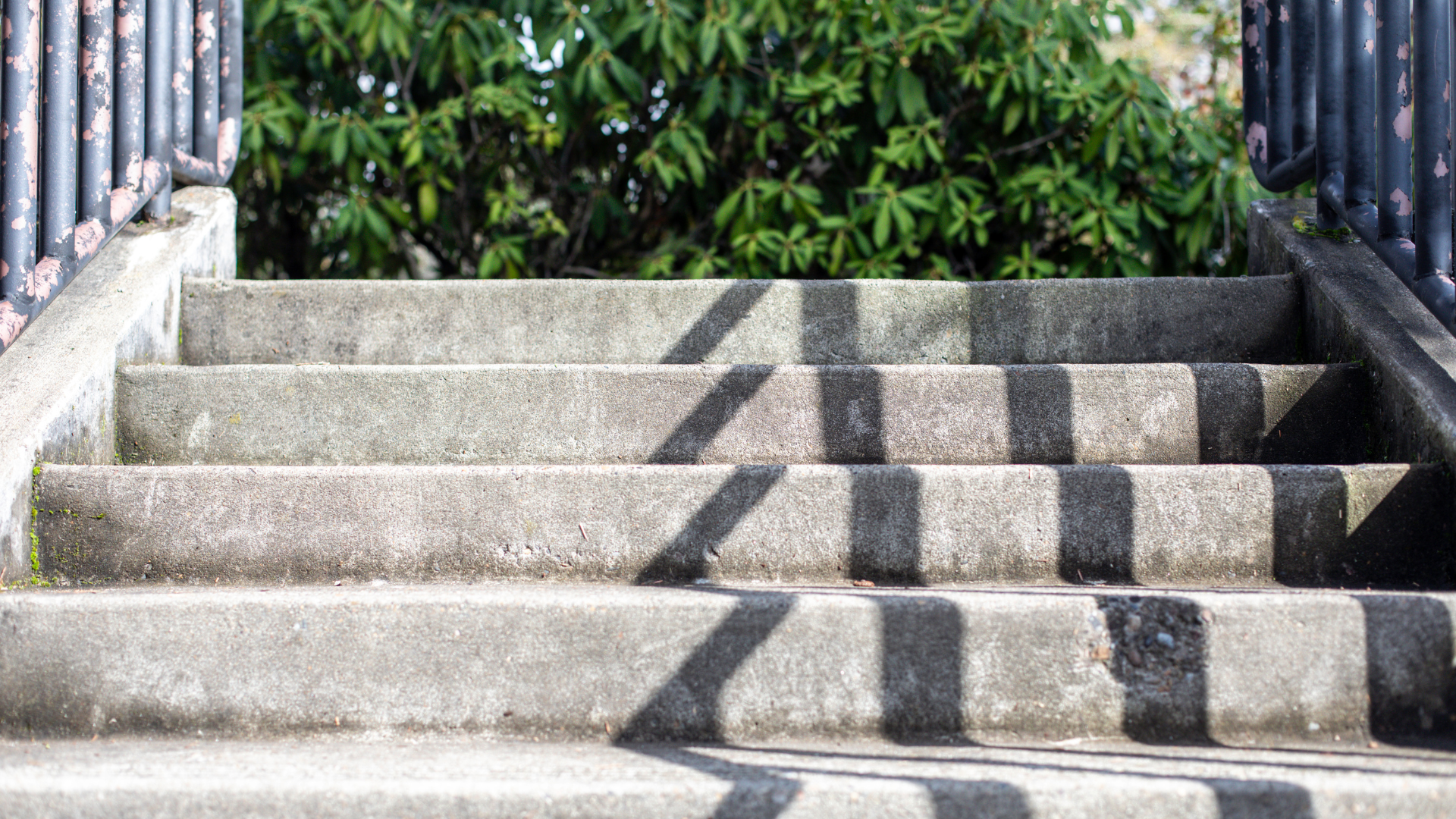 a close up of a set of stairs with a fence in the background