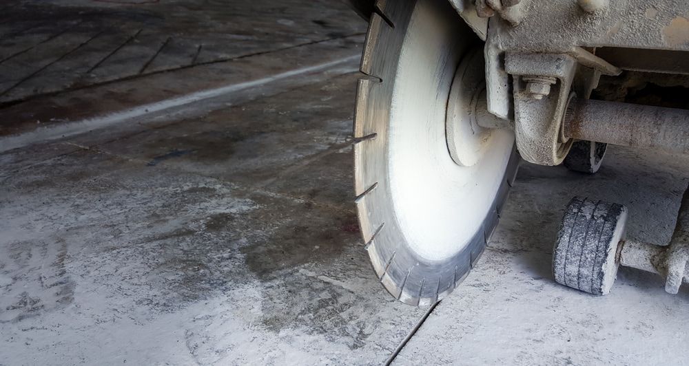 A Close Up Of A Circular Saw Cutting Concrete — Pro Cut N Core In Manunda, QLD