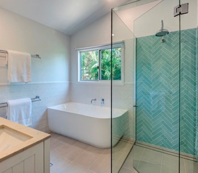 A Bathroom With a Bathtub and a Walk in Shower — Coral Coast Building & Management in Cannon Valley, QLD