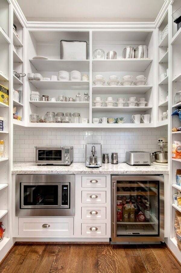 A Pantry With Lots of Shelves , Drawers , a Refrigerator , and a Microwave — Coral Coast Building & Management in Cannon Valley, QLD