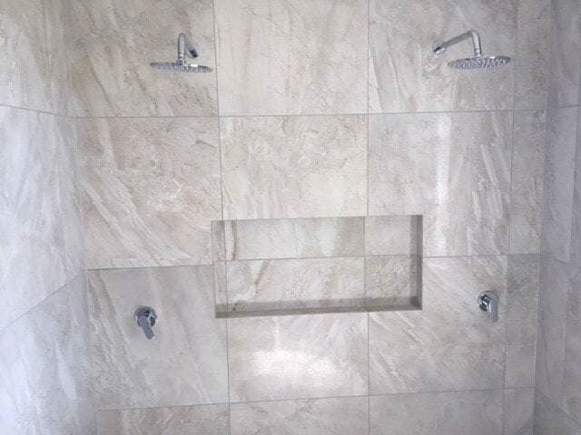 A Shower With Two Shower Heads and a Niche in the Wall — Coral Coast Building & Management in Cannon Valley, QLD