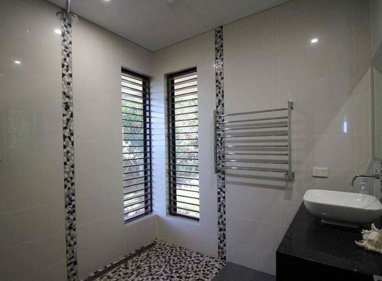 A Bathroom With a Sink and a Walk in Shower — Coral Coast Building & Management in Cannon Valley, QLD