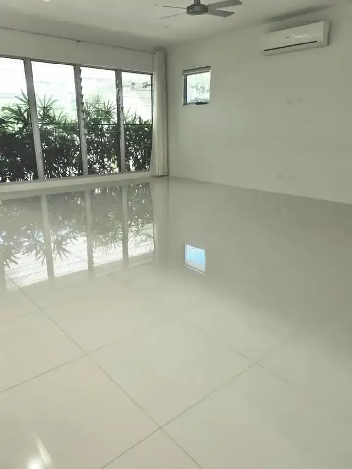 A Large Empty Room With a Lot of Windows — South Pacific Cleaning in Bentley Park, QLD