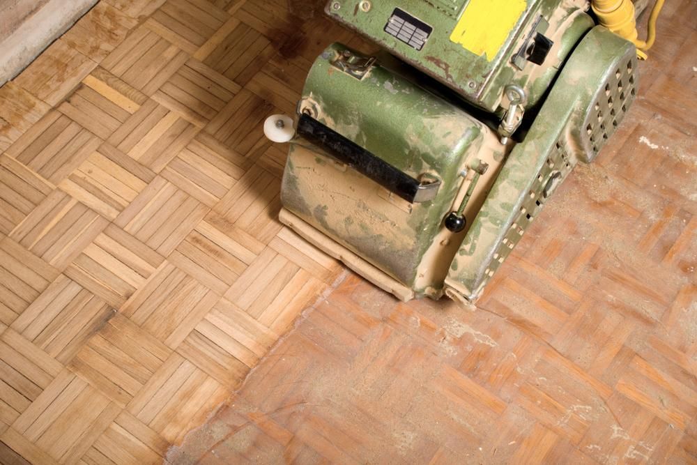 A Machine is Sanding a Wooden Floor — South Pacific Cleaning in Edmonton, QLD