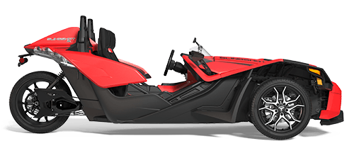 A red and black slingshot motorcycle on a white background.