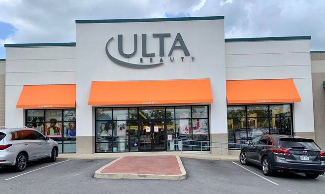 A ulta store with cars parked in front of it
