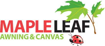 A maple leaf awning and canvas logo with a ladybug