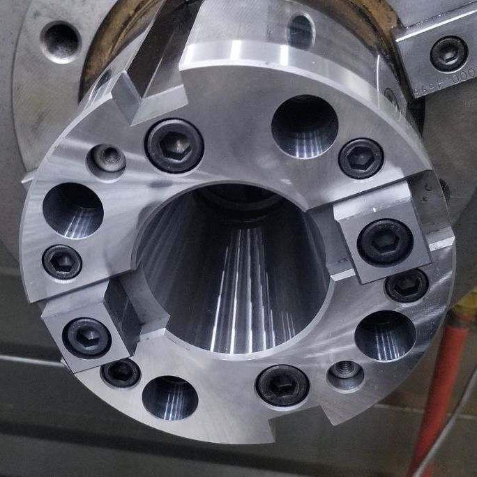 Locher HD image of a machine repair tech in the middle of doing Headstock Rebuilds