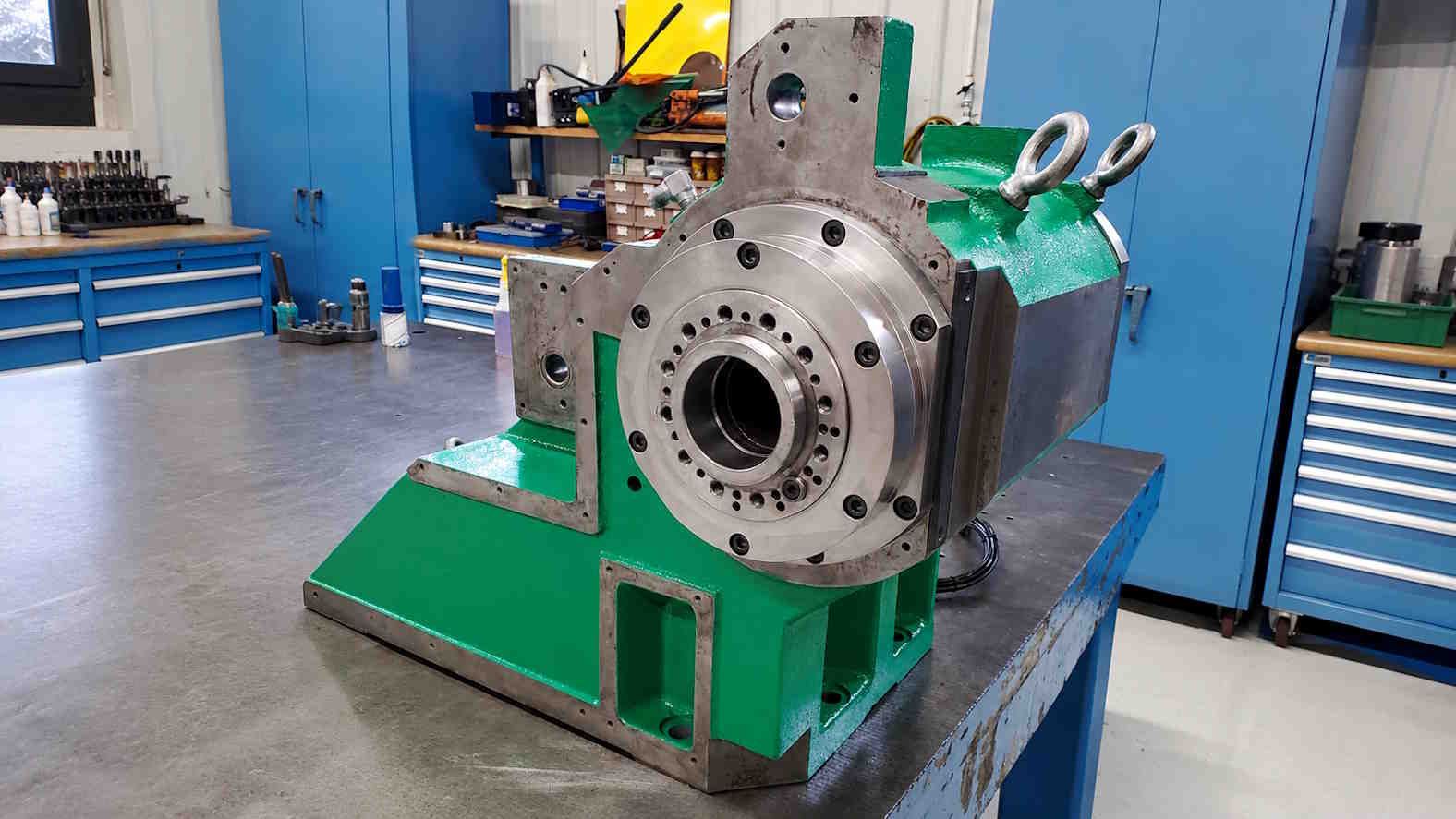 Locher HD image of a machine repair tech in the middle of doing Headstock Rebuilds