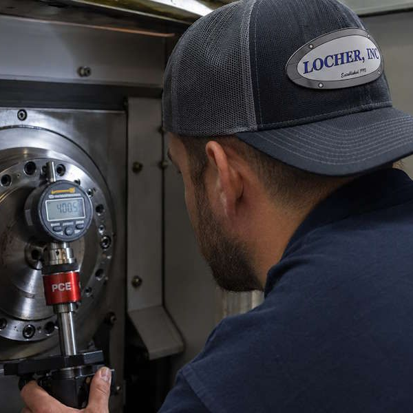 Locher tech using a drawbar retention force gauge