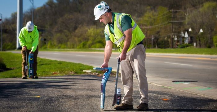 Man Locating a Buried Waterline